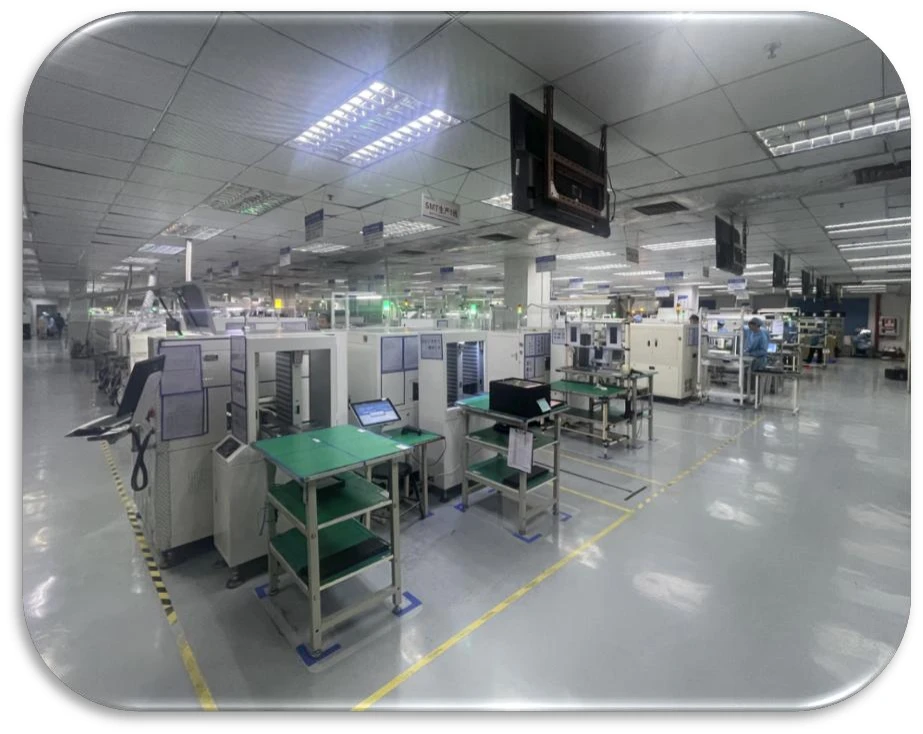 Supplied SMT production-environment reference showing assembly equipment along a factory aisle.